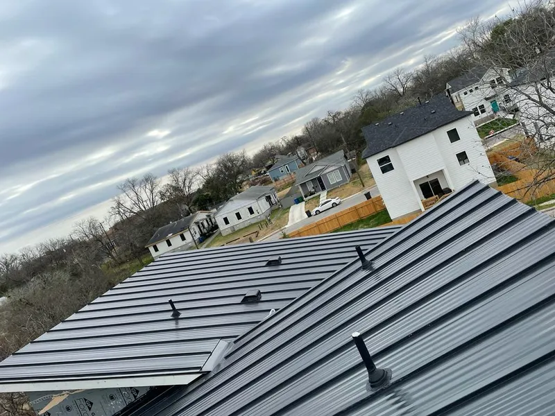 Standing seam metal roof panels with vents for Skylight Repair in Farmers Branch